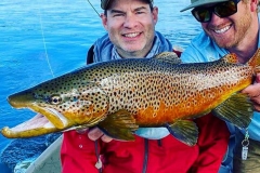 men holding fish