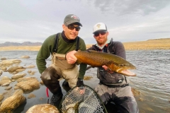 men holding trout