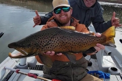 man holding up fish